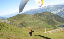 Gleitschirmflieger am Starten für den Flug | © Bergbahnen Flumserberg AG